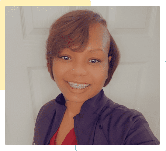 Smiling woman with short hair and professional attire.