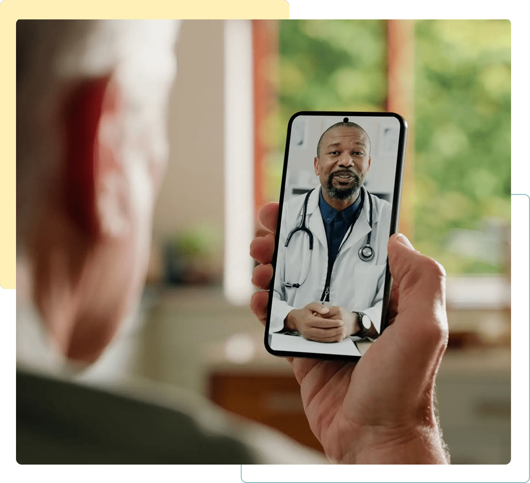 Senior man video chatting with a doctor on his smartphone.